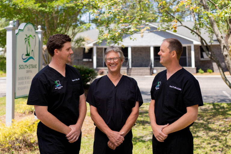 The dentists of South Strand Dental from left to right: Dr. Benjamin H. Collins, Dr. Danny Miller, Jr., and Dr. Dan Miller III.